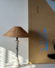 Load image into Gallery viewer, Wicker lamp on a white surface with a blurred background
