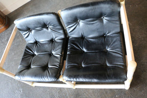 MCM mid-century modern  love seat with black vinyl upholstery in the style of Jerry Johnson for Landes Manufacturing Co.